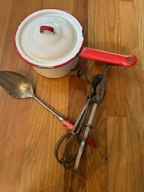 Vintage Red and White Enamel Saucepan with Red-Handled Utensils